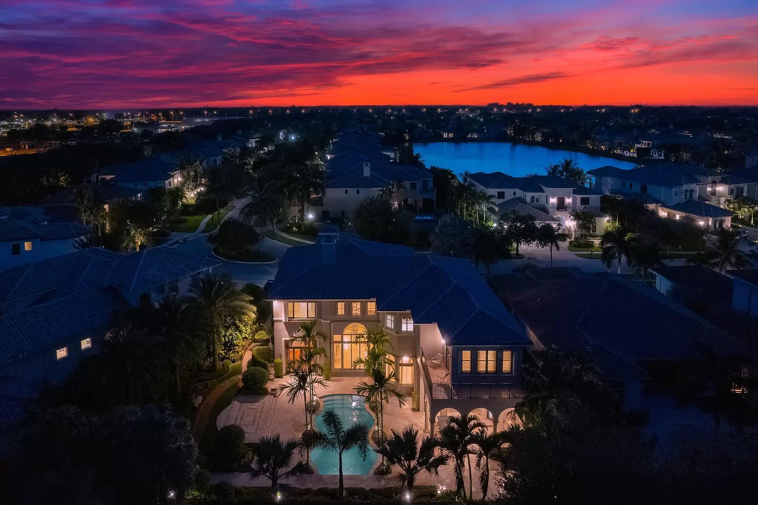 Aerial view of a waterfront estate at dusk