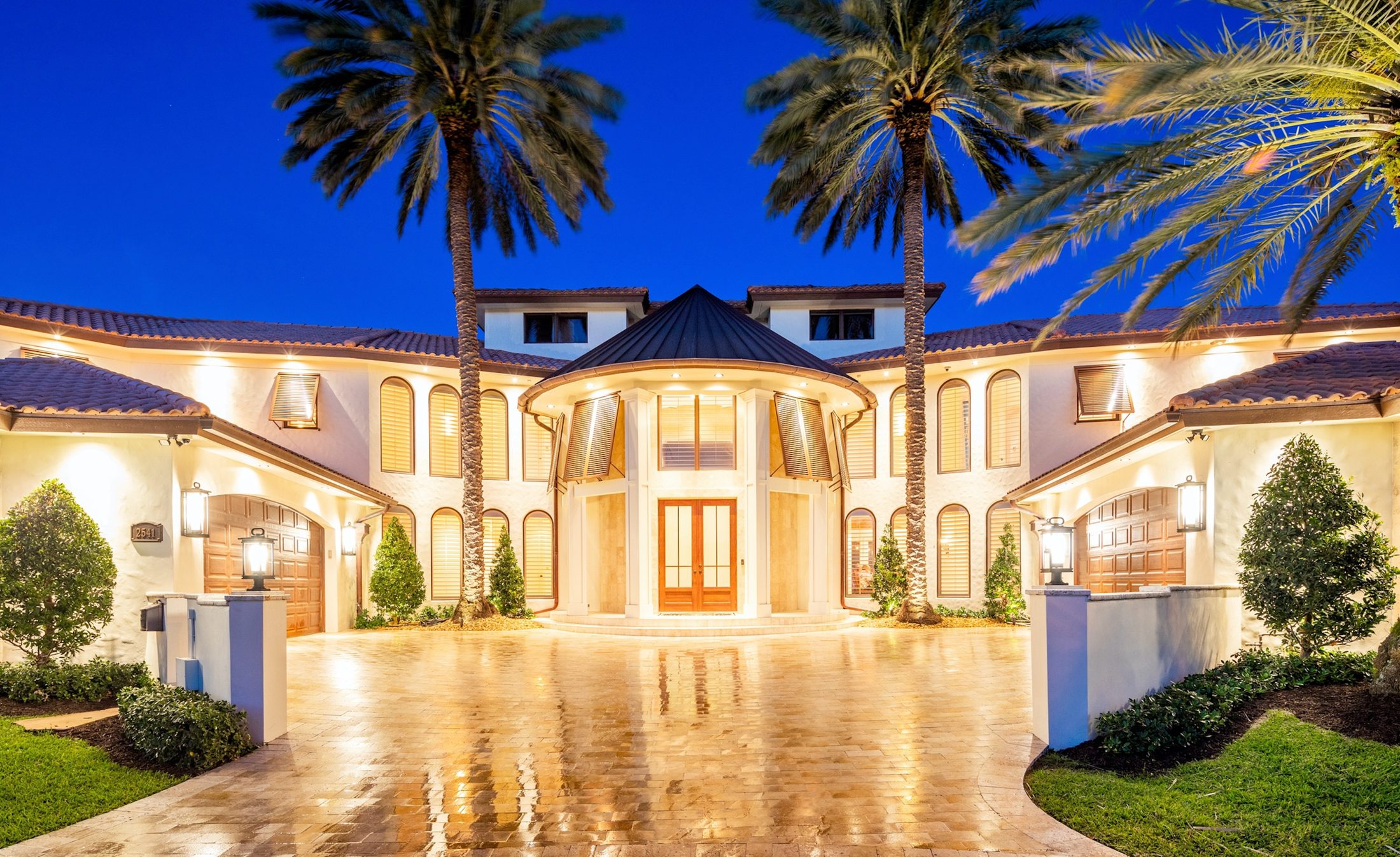 An illuminated Mediterranean estate courtyard